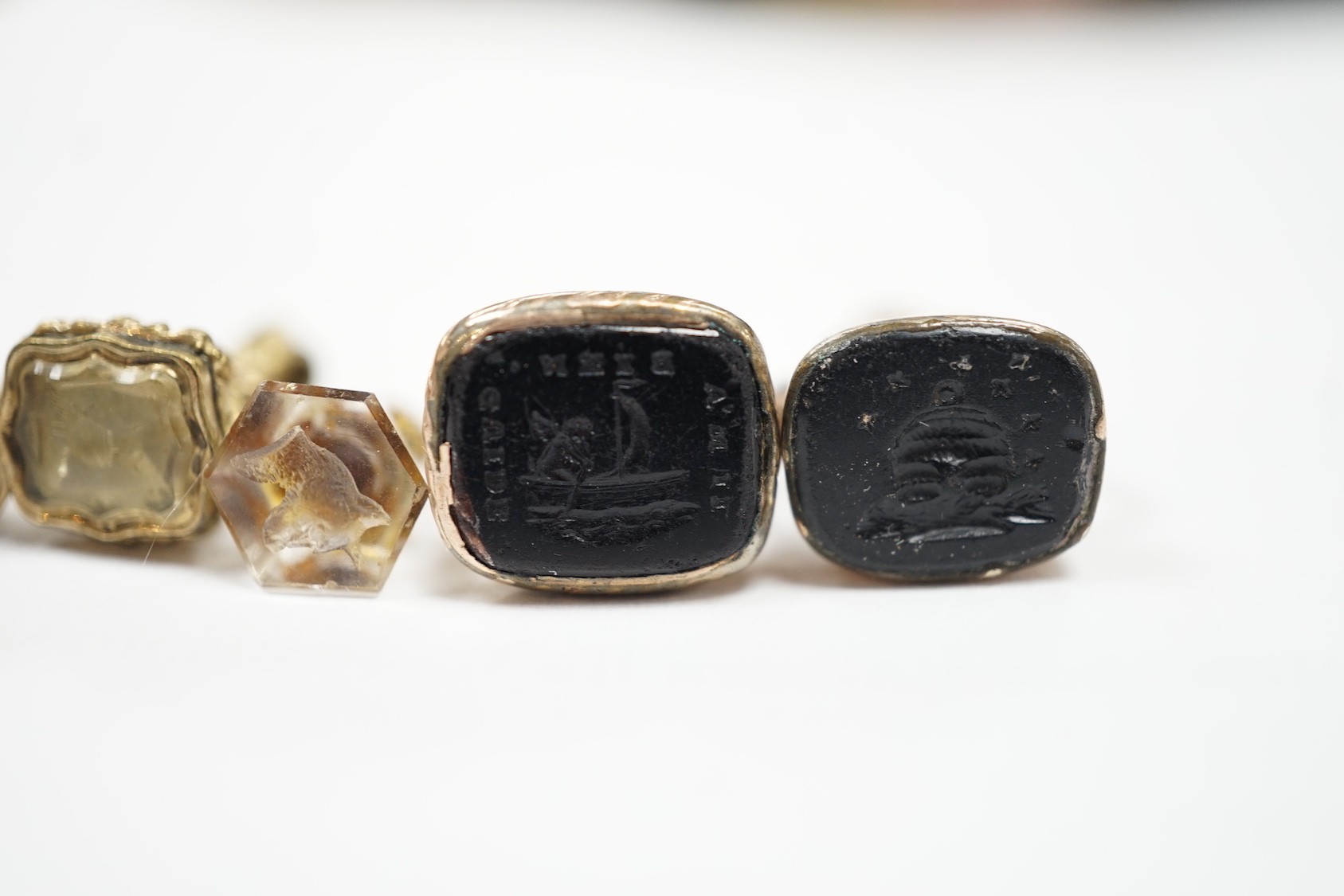 A collection of twelve small 19th century mainly yellow metal fob seals, with assorted matrices including bloodstone, amethyst, citrine and carnelian, largest 22mm.